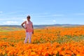 Lancaster, Ca / April 12, 2019 - Admiring the golden poppies in full bloom covering the hillsides in the Antelope Valley with brig