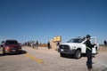 Lancaster, California - March 24, 2019: Police officer directing traffic at the Antelope Valley Poppy Fields as crowds of people