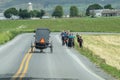 Group of Amish People Walking on Road