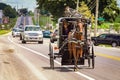 Lancaster, PA / USA - 7/4/2013: Amish man riding a retro carriage on the street