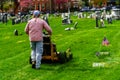 Working Cutting Grass in Cemetery