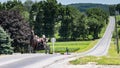 Amish Open Family Horse and Buggy Out for a Stroll on a Sunny Sunday in the Countryside