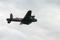 Lancaster WW2 bomber in a cloudy sky.