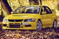 Lancer Evo 9 in the autumn road Royalty Free Stock Photo