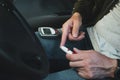 Lancet pen and glucometer in the hands of a man in a car. Diabetes concept Royalty Free Stock Photo