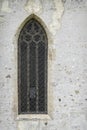 Lancet window on the wall of Parochial Church in Fiera di Primiero. Royalty Free Stock Photo