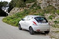 Lancia Ypsilon 3rd generation mini hatchback in hills at Erice, Sicily