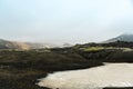 Land covered in fresh moss and melting snow seen while trekking in Iceland. Royalty Free Stock Photo