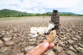 Land with dry and cracked ground because dryness global warming Royalty Free Stock Photo