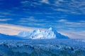 Land of ice. Travelling in Arctic Norway. White snowy mountain, blue glacier Svalbard, Norway. Ice in ocean. Iceberg in North pole Royalty Free Stock Photo