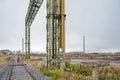 Land of an old chemical fertilizer factory owned by CUF and Quimigal, which stopped working in the 1980s. Person walking.