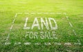 Land plot management - real estate concept with a vacant land on a green field available for building construction and housing Royalty Free Stock Photo