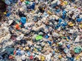 Land pollution with plastic bottles and bags. Open storage of solid waste garbage. Aerial top view Royalty Free Stock Photo