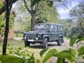 Diesel car in a greenery, Land Rover Defender 110 Royalty Free Stock Photo