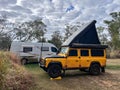 Land Rover Defender 110 Station Wagon with rooftop tent camping in the outback of Queeensland Australia