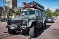 Land Rover Defender SUV equipped for adventure with the roof rack full of tools and supplies