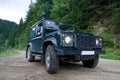 Land Rover on forest road Royalty Free Stock Photo