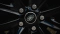 Land Rover logo on the wheel. Range Rover Sport wheel close-up.