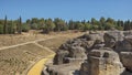 Land and ruins of the amphitheater, part of archaeological ensemble of Italica, Seville, Spain