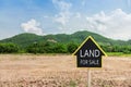 Land for sale sign against trimmed lawn background Royalty Free Stock Photo