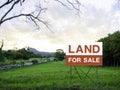 Land for sale sign on empty land Royalty Free Stock Photo