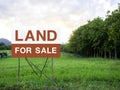 Land for sale sign on empty land Royalty Free Stock Photo