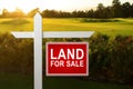 LAND FOR SALE SIGN on empty meadow - Real estate conceptual image. Royalty Free Stock Photo