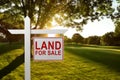 LAND FOR SALE SIGN on empty meadow - Real estate conceptual image. Royalty Free Stock Photo