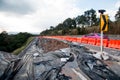 Land slide on asphalt road in thailand.land slide caused by torrential rains on asphalt road in thailand. Broken road asphalt crac