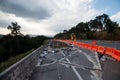 Land slide on asphalt road in thailand.land slide caused by torrential rains on asphalt road in thailand. Broken road asphalt crac