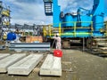 A land surveyor engineer during his work with surveying using theodolite or total station scanner Inside a mechanicalsite Royalty Free Stock Photo