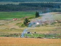 Landfill garbage fire inferno in mountain steppe with heavy smoke