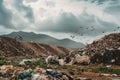 landfill with mountains of garbage and clouds of flies