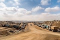 landfill site, with trucks coming and going, bringing new waste to be disposed Royalty Free Stock Photo