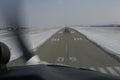 Landing aircraft on paved runway Royalty Free Stock Photo