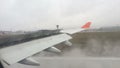 Landing of an aircraft on the runway in the fog with a view of the wing. Issue spoilers on landing.