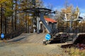 Landing area on chair lift in autumn mountain forest