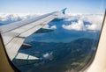 Landing in the city of Vancouver. Aerial view. Buildings, houses, river. Sunny day and cloudy sky.