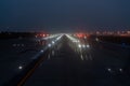 Landing lights ON A airport runway at night sky. Royalty Free Stock Photo