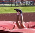 Landing into the mat during high jump Royalty Free Stock Photo
