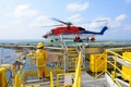 The landing officer are loading baggage of passenger to helicopt Royalty Free Stock Photo