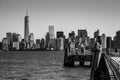 Landing pier at Liberty Island in front of New York skyline Black and White Royalty Free Stock Photo