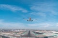 Landing plane in blue sky