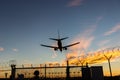 Landing plane over barbwire Royalty Free Stock Photo