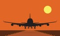Landing plane over runway at sunset. Flat and solid color