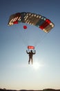 Landing a skydiver against backlight.