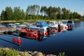 Landing stage with launches on forest lake.