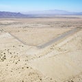 Landing strip in desert. Royalty Free Stock Photo
