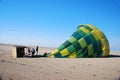 After landing a team of helpers packs up a hot air balloon