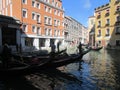 Landing tourists in gondolas, Venice, Italy.